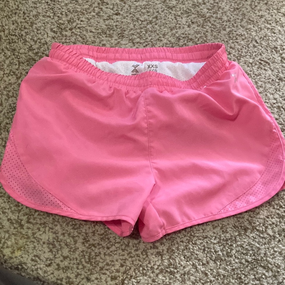 Girls’ quick-dri, pink shorts. Size 4/5 XXS